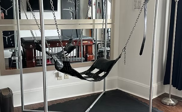 Suspended sling in mirrored play space